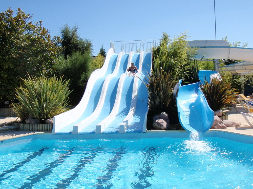 Jenny going down the water slide. You need some luxuries when traveling.