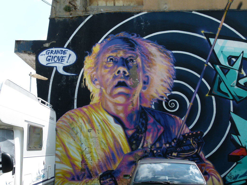 View of the graffiti on the wall at the carpark in Ferrara, in front of our parking spot.