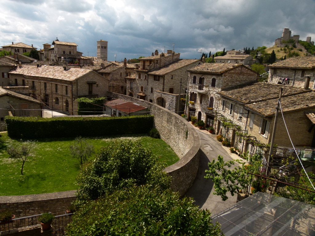 on the outskirts of the town buildings around and old amphitheater.