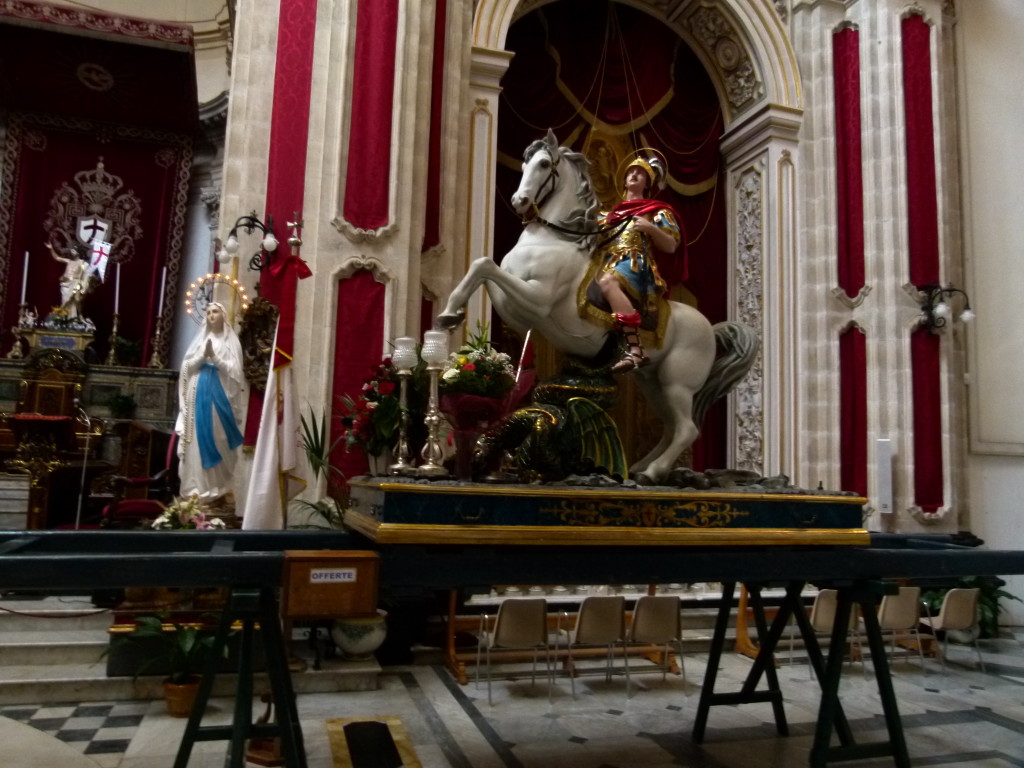 In the church we saw a statue of St George and the Dragon. This they parade around the town in a festival in late May. Why ??