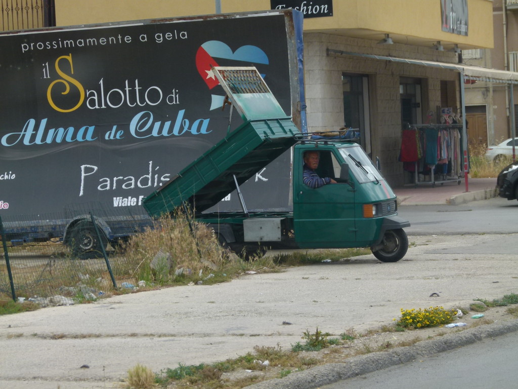 We stopped on the road due to a motorbike accident and saw this one with a tipping tray on the back.