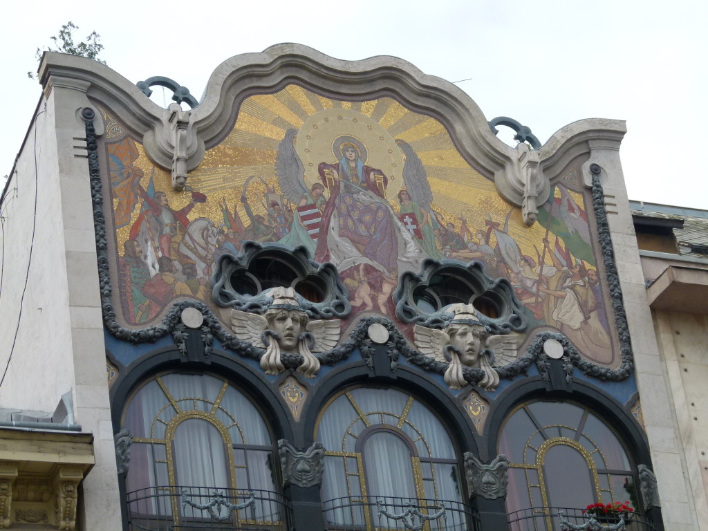 Art nouveau decoration on the top story of a Budapest building