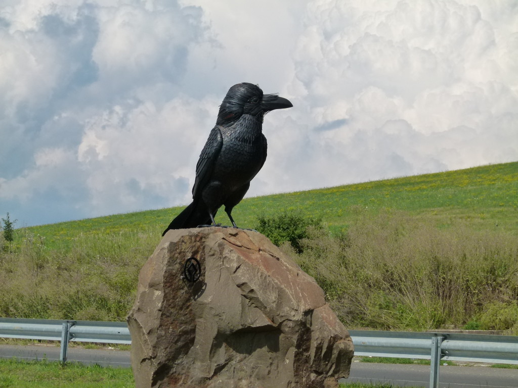 Bird statue on road near Holloko