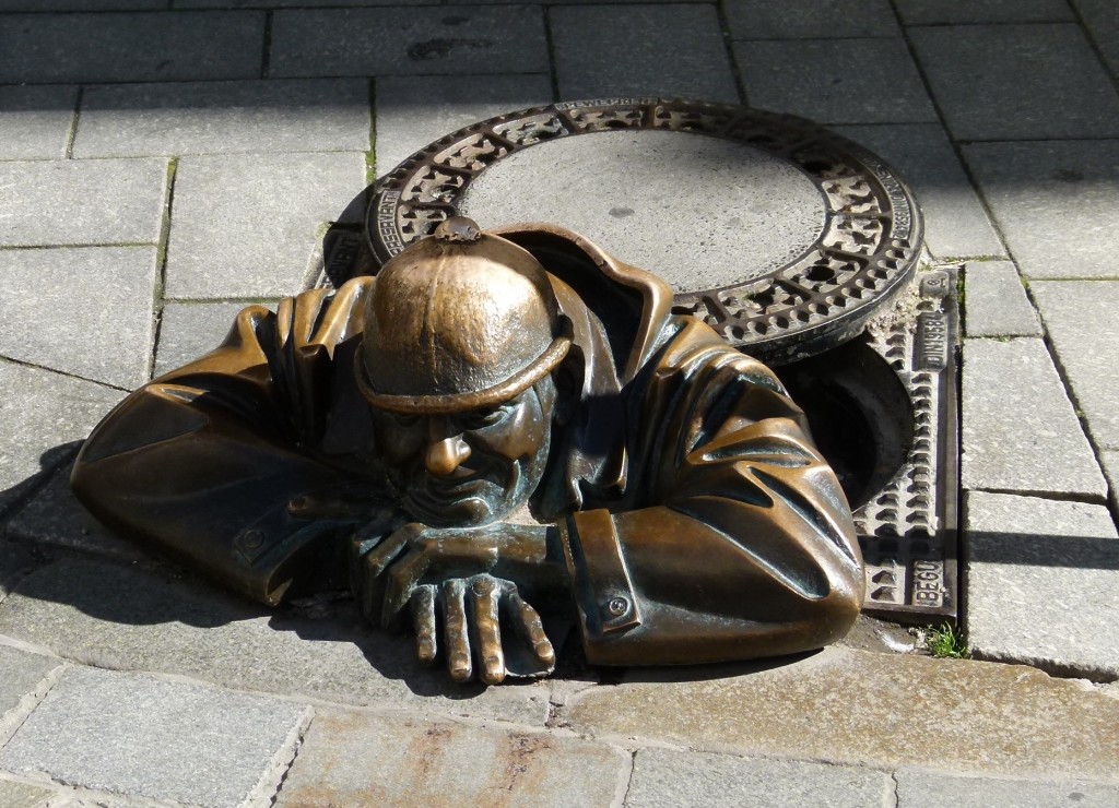 This is the statue of Cumil a worker coming up from the manhole in the street. He has become a landmark of Bratislava.