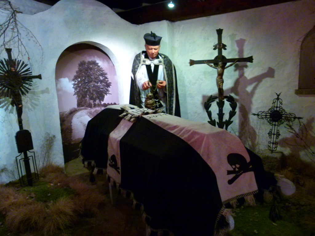 Another display depicting a funeral.