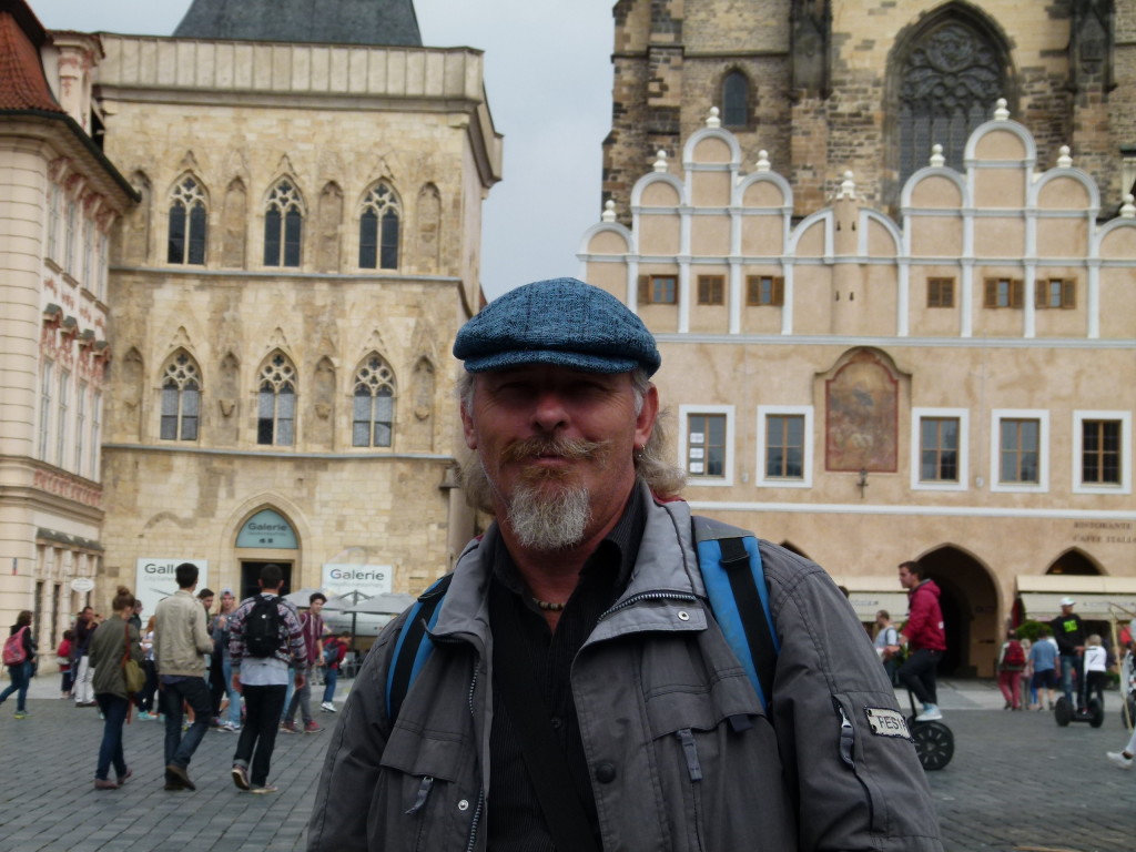 Ewout in the old town square with his new hat.