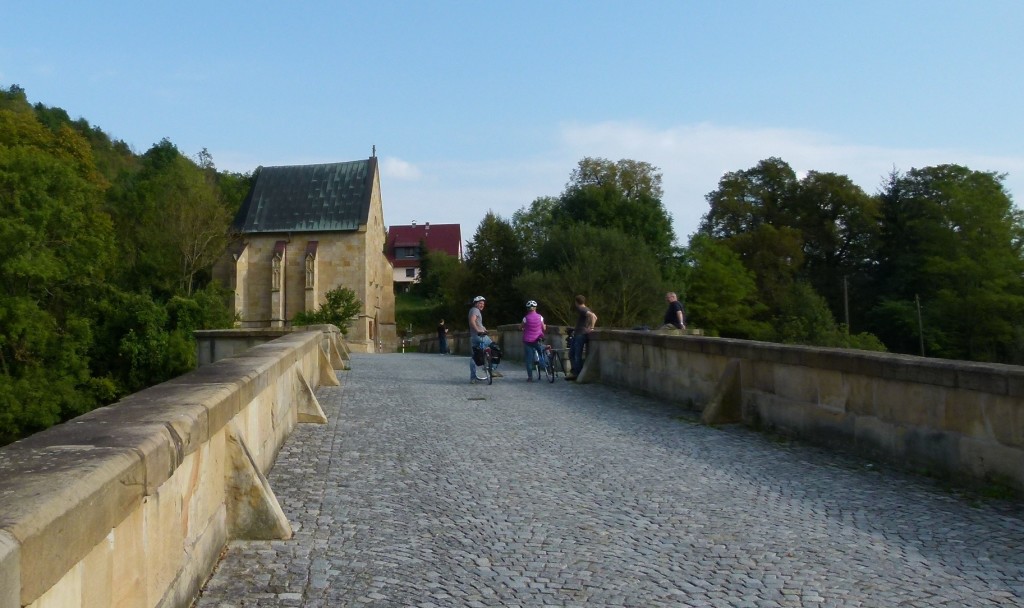 Film crew and actors on bridge