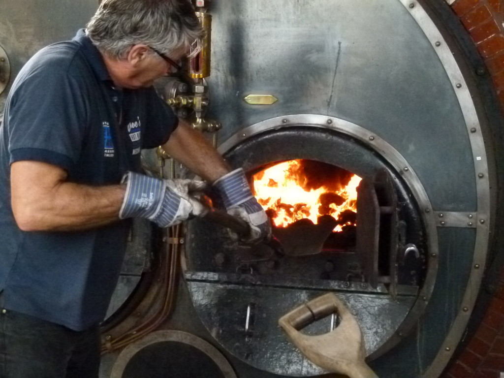 Stoking the boiler. Many of the steam engines were operating.