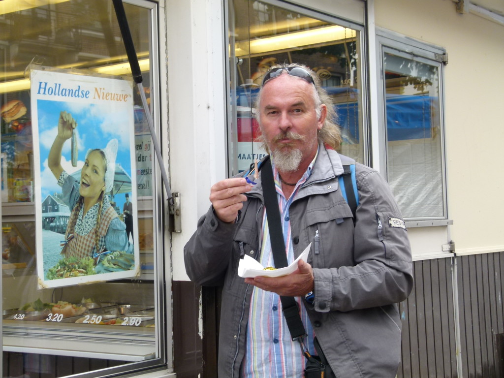 Ewout with his Hollands Niew,( Fresh uncooked herring with onions and pickles