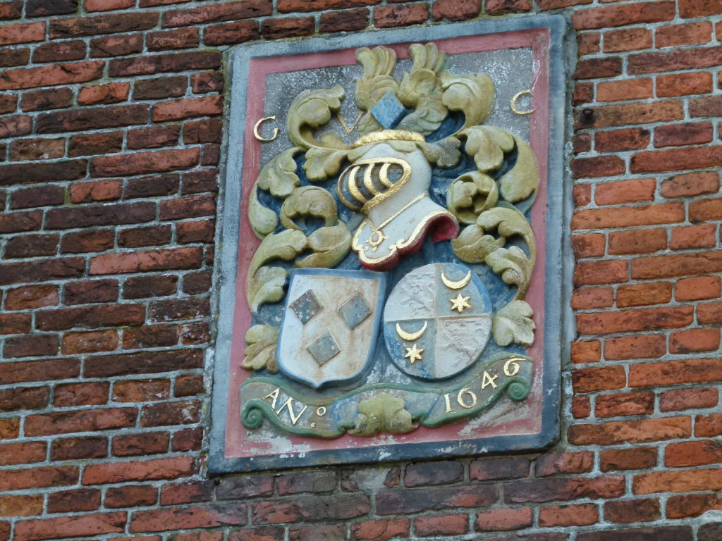 Crest on the side of the building.