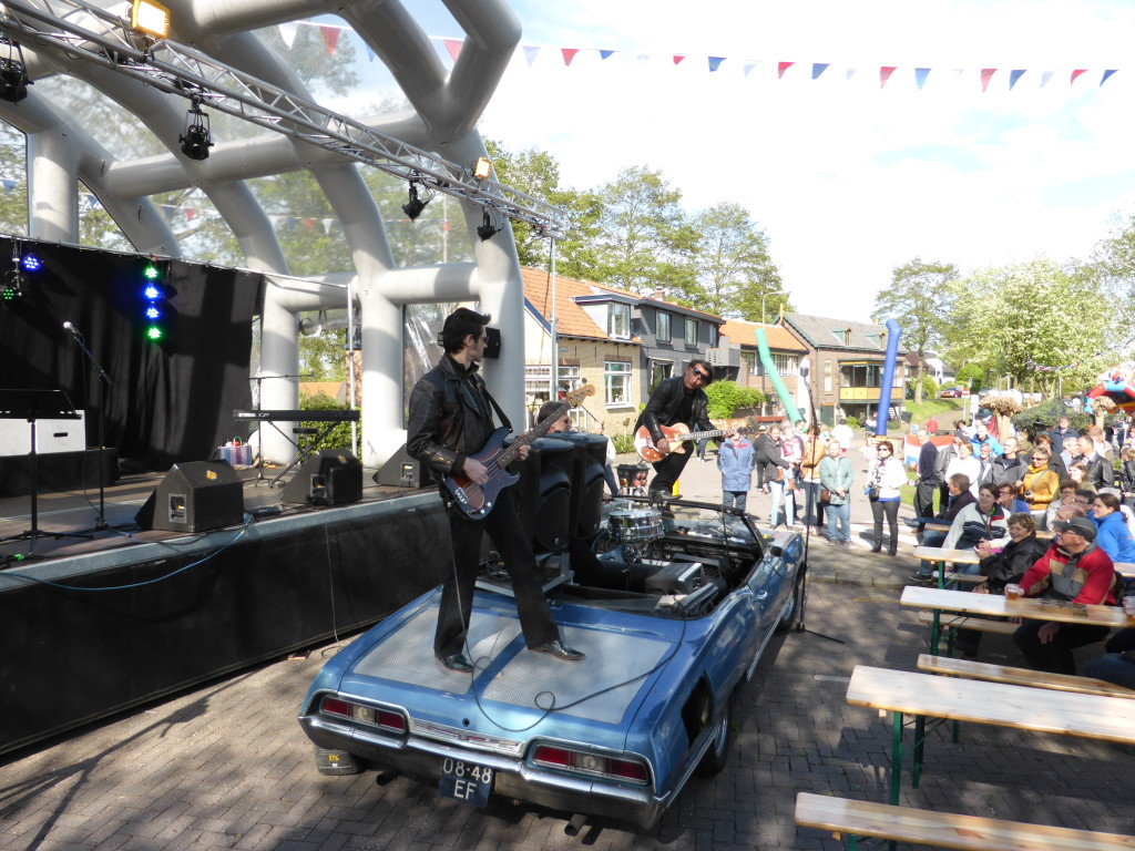 The group was called " Johnny and the Gangsters of Love". They brought there own state an old car. You can guess the type of music they played.