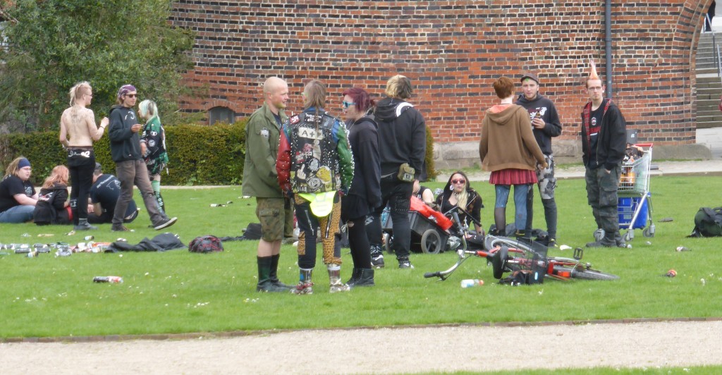 Punks in the park in front of the town gates.