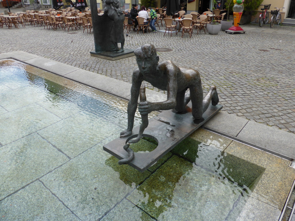 Statue of a boy catching eels. 