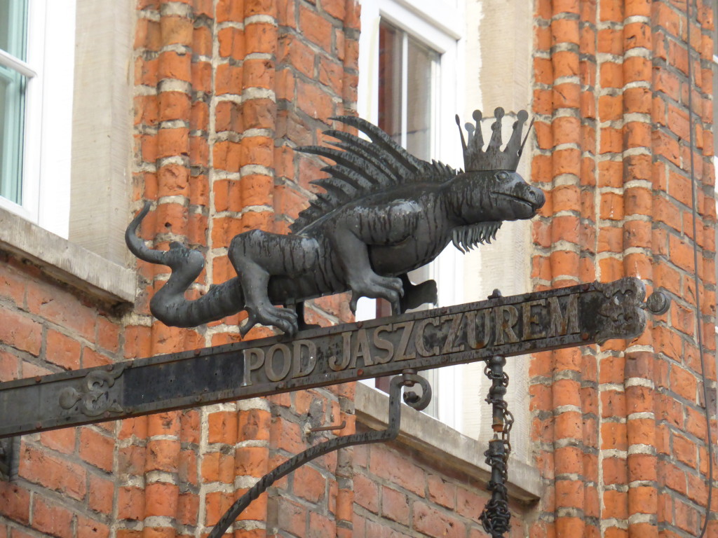 Sometimes you just have to look up. Here is the lizard king over a shop.