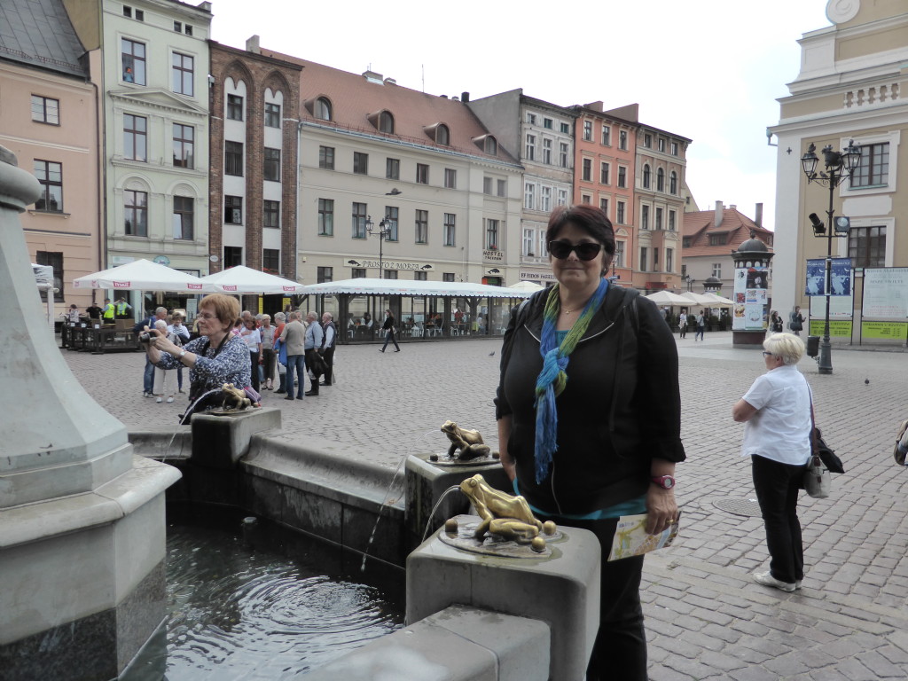 Jenny at the frog fountain in the town square.