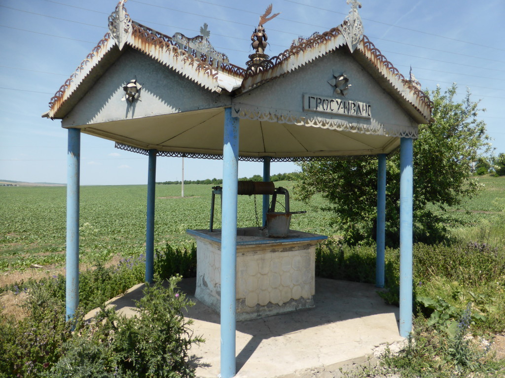 Well, well. well. Everywhere there were wells, of all types. This was quite a fancy one on the side of the road.