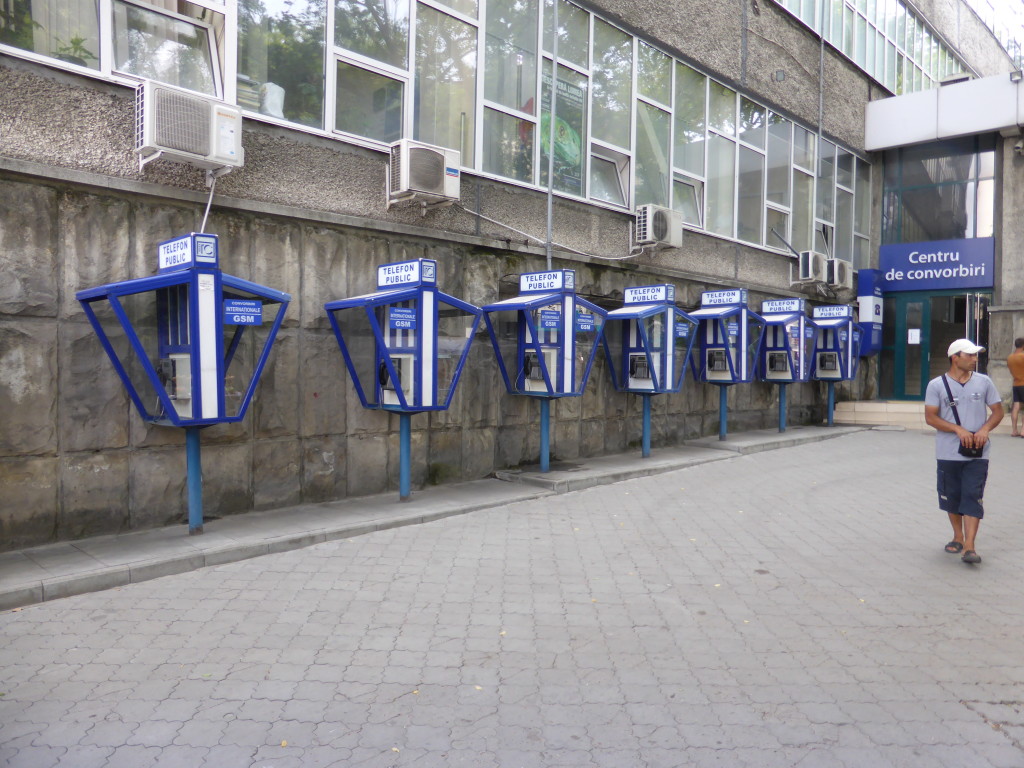 This is something that I haven't see for awhile public telephone boxes all in a row.