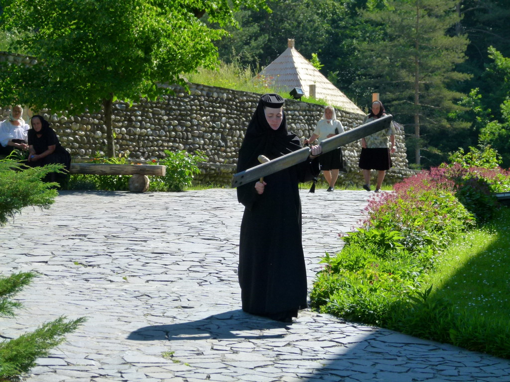 Not sure what was happening, this nun walked around banging a piece of wood with a mallet. 