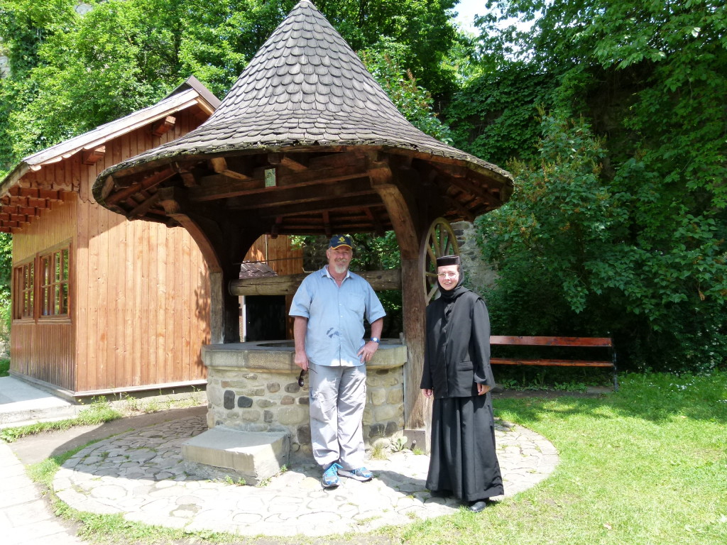 The friendly nun showed us how the double bucket well worked.