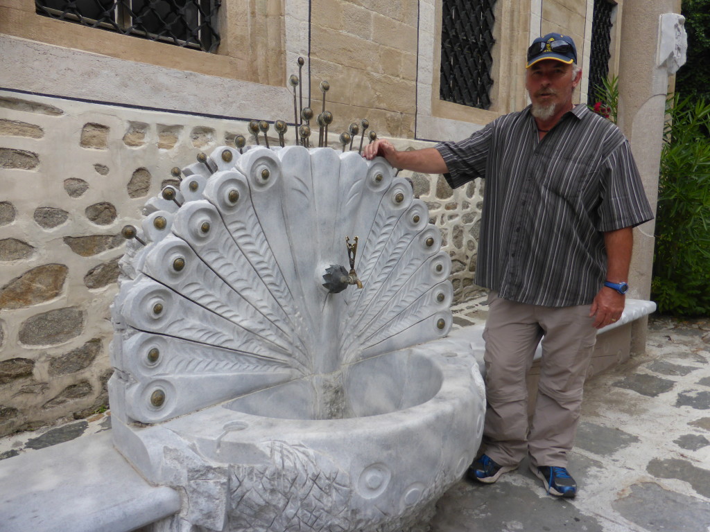 Water fountain in the shape of a peacock. It was a warm day and it was good to see water available. 