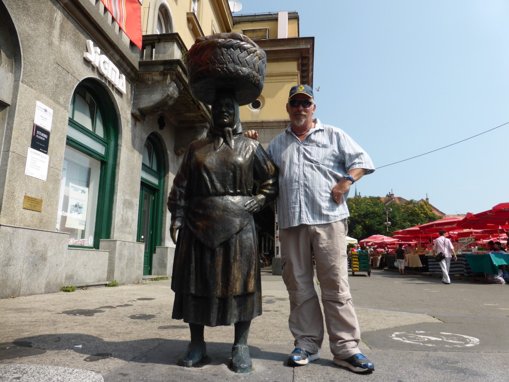 Ewout with the market lady.This statue is at the entrance to the market which still exists. 