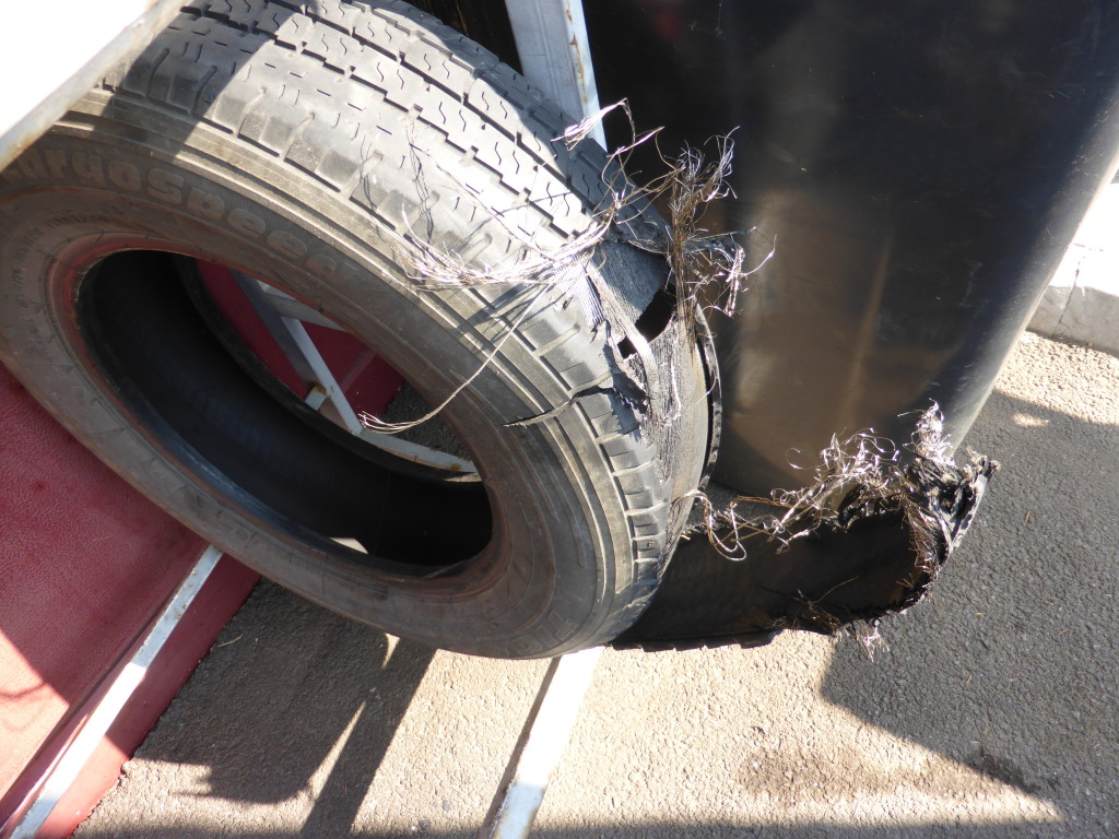 As you can see it was not just a simple puncture but a complete deterioration. We couln't drive as it was because the loose flap kept hitting the underside of the vehicle.